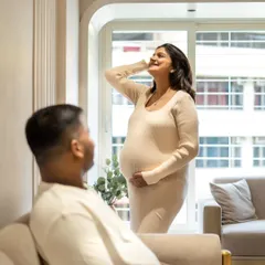 A candid moment during an in-home session. I love capturing the parents-to-be interacting naturally. Here, he's admiring his beautiful partner as she soaks in the sunlight from the window.
