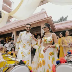 A Haldi ceremony that was pure sunshine and smiles. The couple, dressed in coordinated sunflower-print outfits, made their entrance with dhol players, setting a fun and festive tone for the day.
