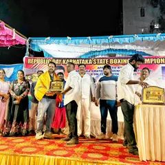 On stage being felicitated during the Republic Day Karnataka State Boxing Championship event. My involvement in the state's boxing community is something I value deeply.