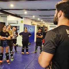 A view from behind the coach, showing an attentive group of students ready to learn. We welcome all levels, and our female students are a strong part of our striking crew.