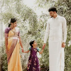 A beautiful outdoor portrait of the family of three, soon to be four. Holding hands and sharing a look, this photo captures the bond between parents and their child.