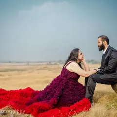 I love capturing these quiet, tender moments. Here, she is looking up at her partner with so much love, her incredible red and purple gown flowing around them. It’s a perfect, intimate pre-wedding portrait.