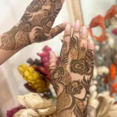 Get ready to dazzle with this designer henna. The bold rose motifs create a modern and stylish look, perfect for any party.