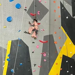 This young climber from our outreach event fearlessly scales the wall. I believe in providing opportunities for everyone to experience the confidence boost that comes from conquering a climb.