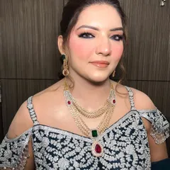 A close-up of the party makeup, highlighting the sharp winged liner and the beautifully flushed cheeks.