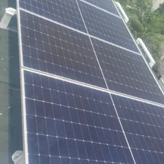 Sustainability is built into our projects from the ground up. Here, we are installing high-efficiency solar panels on the roof of a modular home, reducing the carbon footprint and lowering long-term energy costs for residents.