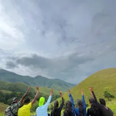 A group reaching for the sky on the Kudremukha trail. The sense of achievement and camaraderie is what makes these treks so special for any group.