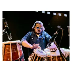 Our percussionist getting the levels right during a sound check. The calm before the storm.