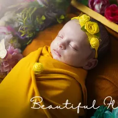 A beautiful floral newborn portrait created entirely in the client's home. This shows the quality and creativity we bring to every at-home session.