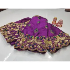 A pair of beautifully embroidered peacock sleeves in a rich purple hue. The scalloped edges and detailed feather work showcase the artistry involved.