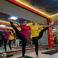 Finding balance together. This partner pose not only challenges stability but also requires communication and mutual support.
