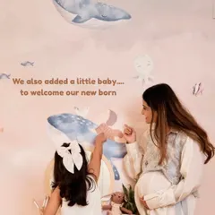 A special detail in the new wallpaper was adding a little baby beluga to welcome our newborn, a sweet way to include him in her space.