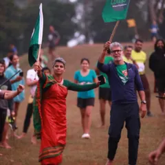 Waving the flag at the start line of the Barefoot Marathon. The energy and spirit of the runners is incredibly inspiring and makes this event so special.