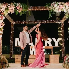 A dance to celebrate the 'yes'. The couple shares a joyful moment on the stage we created for their special proposal.