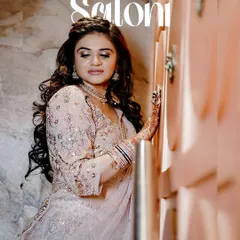 A stunning portrait of the bride-to-be, Saloni, during her ring ceremony. The soft lighting highlights her makeup and elegant embroidered outfit.