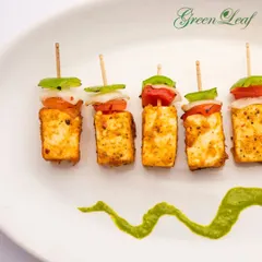 My paneer tikka is a signature appetizer, marinated in spices and grilled to perfection. Served on skewers with chunks of bell pepper and onion, it's a flavorful and satisfying start to any wedding menu.