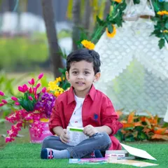 A happy moment from a three-year-old's themed photoshoot. Our tent setups are versatile and can be customized with flowers and props to match your child's favorite colors and interests.