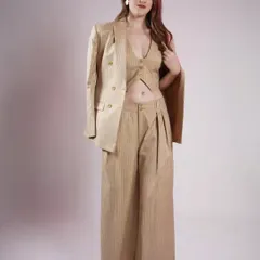 A beige pinstripe three-piece suit, perfect for making a statement. The blazer, waistcoat, and wide-leg pants create a powerful and stylish silhouette.