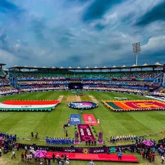A wide shot of the pre-ceremony setup for the ICC Women's World Cup, showcasing the massive on-field flag display. We managed all logistical aspects, including the national anthem ceremony and walkout elements.