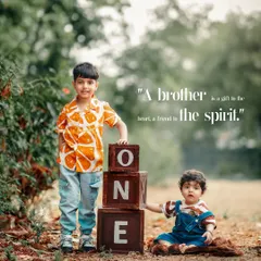A heartwarming outdoor portrait celebrating the special bond between brothers during a first birthday photoshoot. We always welcome siblings to join in and create lasting family memories.