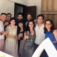 A group of happy guests enjoying their drinks at a house party. Our goal is to make sure everyone has a great time and a perfect drink in hand.