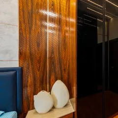 A close-up showcasing a rich, dark wood veneer with a beautiful grain and a subtle gloss finish. This material adds warmth, texture, and a sense of luxury to any piece of furniture.