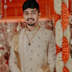 A portrait of the groom in his traditional Muhurtham attire, looking calm and ready for the ceremony.