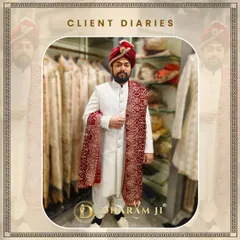 A client looking absolutely regal in a classic off-white sherwani, paired with a rich red embroidered stole and a matching pagri. This is a timeless combination for a traditional Indian wedding ceremony.
