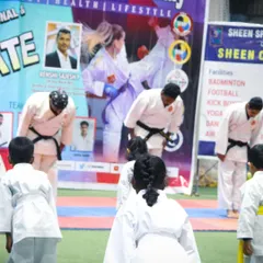 Respect is the cornerstone of martial arts. Students and instructors begin the belt grading ceremony with a traditional bow, honoring the discipline and each other.