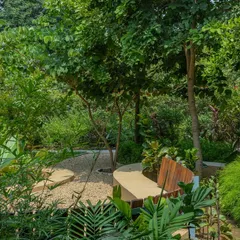**Playfold, Ahmedabad:** The 'Playfold' bench is a multifunctional element that redefines the courtyard as a lived-in outdoor room. It becomes a breakfast table, a cozy nook, a barbeque platform, and a playful ramp for children, all in one continuous form.