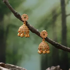 These dainty gold-toned jhumkas are perfect for a subtle touch of tradition. The design features a small floral stud and a filigree bell with delicate ghungroo drops.