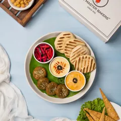 A beautiful overhead shot of our Mezze Platter, showcasing all the fresh components. It's a light, healthy, and sociable way to start a meal.