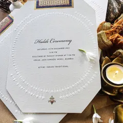 An elegant and minimalist Haldi ceremony invitation with beautiful embossed details. Sometimes, the most luxurious statements are the most subtle.