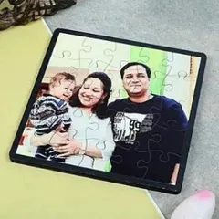 A personalized family photo puzzle is a heartwarming gift. This example shows a happy family portrait turned into a jigsaw puzzle, ready to be assembled.