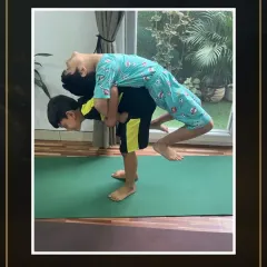 A beautiful example of partner yoga for kids. This pose not only strengthens the back but also requires communication and trust between the partners.