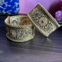 A close-up of our premium bridal kadas. The detailed craftsmanship and screw-on lock make them both beautiful and easy to wear.