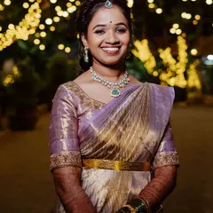 The perfect smile of a happy client for her reception. I created a soft, romantic look with an elegant hairstyle and subtle makeup that highlights her features, beautifully complementing her lavender and gold saree.