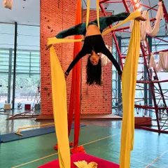 Master the art of aerial silks with us. This beautiful inverted split showcases the combination of strength, flexibility, and control you will develop in our aerial silks program.