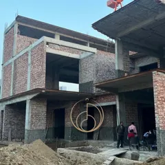 From blueprints to bricks. This image captures the raw beauty of a project under construction, with the foundational structure and brickwork rising from the ground, showing the very first steps of a vision coming to life.