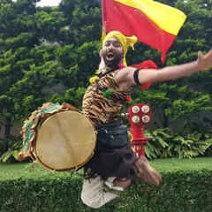 A Dollu Kunitha artist in a moment of pure, unbridled joy. This image, while capturing a fellow artist, also represents the powerful, energetic spirit of the folk forms I work with.