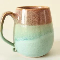 My Pist-a-chio mug features a beautiful, flowing blend of blushing rouge and soft green glazes. The colors melt into each other, creating a dreamy, watercolor-like effect.