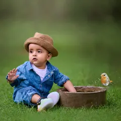 A quiet moment of wonder with a new friend. I love capturing these simple, magical interactions between children and nature during my outdoor photoshoots.