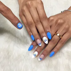 Couple goals. I created this matching set for a couple, with a fun smiley face on his thumb to coordinate with her cute blueberry-themed nails.