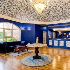 For the Hotel Tivoli, I designed this intricate ceiling wallpaper inspired by Mughal patterns. The design complements the royal blue walls and grand architecture, adding a layer of heritage and luxury to the reception area.