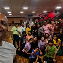 A group selfie with our director after a successful workshop. These moments of connection with our students are what make our community so special.