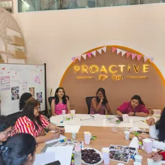 Our therapists facilitating a discussion during the vision board workshop. This isn't about toxic positivity; it's about tackling what really holds women back and turning it into an action plan.