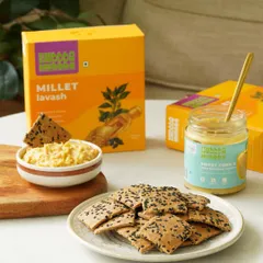 This shot pairs crunchy millet lavash with a creamy sweet corn hummus. The styling creates a perfect serving suggestion for customers.