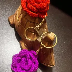 My new rose keychains are here! This red and purple one are being modeled by my little turtle friend, Leo.