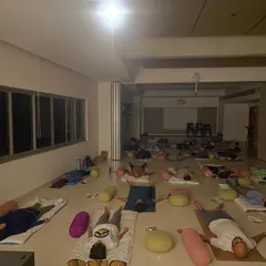 The culmination of a calm mind experience I led for the Unboxing Bangalore Habba. Participants are in deep relaxation, finding a moment of collective mindfulness and quiet in a large, open space.
