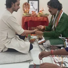 The sacred thread ceremony during Guru Poornima with my Guruji. This ritual symbolizes the unbroken bond and the passing of knowledge from the Guru to the disciple, a tradition I hold very dear.